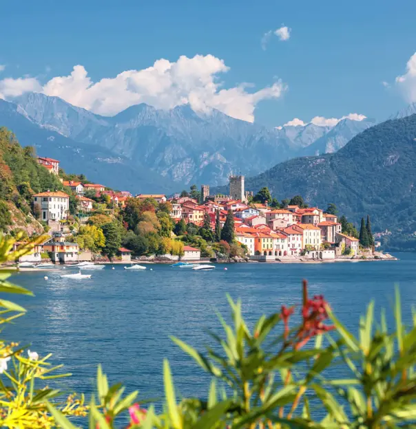 View of houses on the waterfront in Malcesine, Lake Garda with mountains in the distance